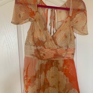 Delicate and soft coral blouse with shell/pearl like button down back